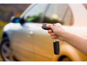 Women's Hand Presses On The Remote Control Car Alarm